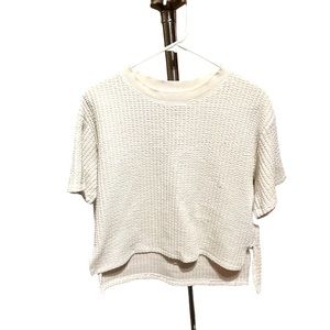 White quilted crop top. Has slits on each side. Size Medium.